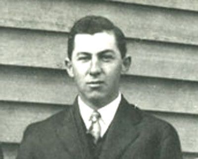 A black and white photo of two men in suits.