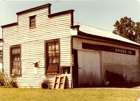 A white house with a door and windows.