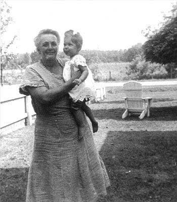 A woman holding a child in her arms.