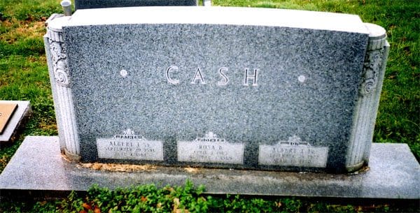 A gray granite headstone with the name cash on it.