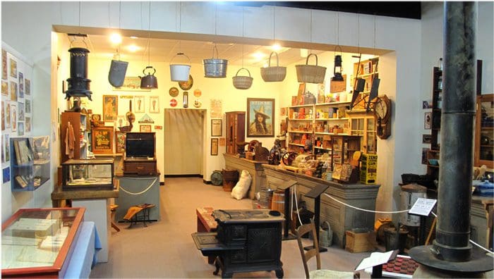 A room filled with lots of furniture and many shelves.