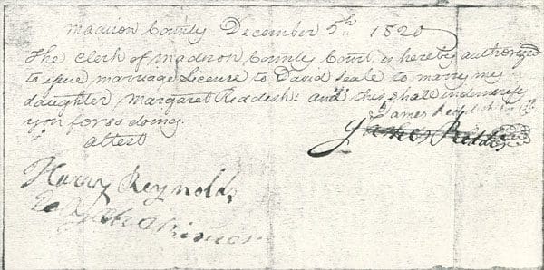 A handwritten document is shown with the date of birth.