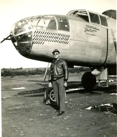 A man standing in front of an airplane.