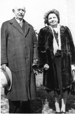 A man and woman standing next to each other.