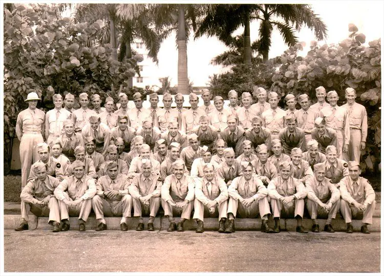 A group of men in uniform posing for a picture.