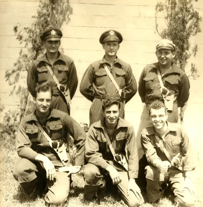 A group of men in uniform posing for the camera.