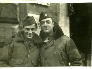 Two men in military uniforms posing for a picture.