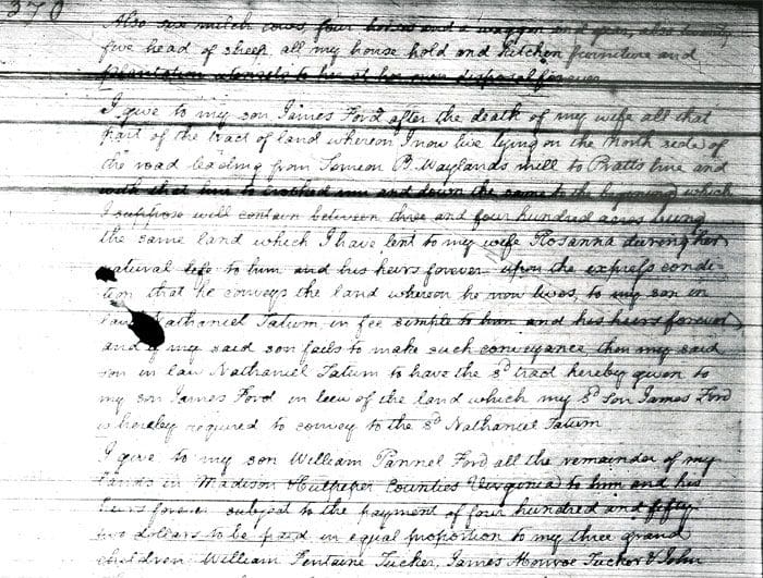 A page of handwritten text with a black spot.