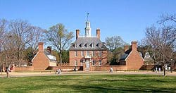 A large brick building with people walking around.