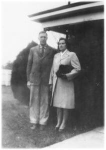 A man and woman standing next to each other.