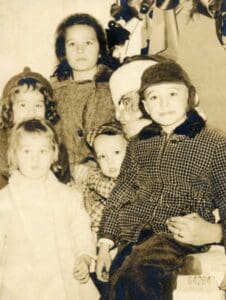 A group of children posing for the camera.