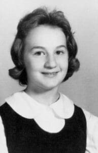 A young girl in a school photo.