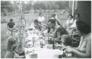 A group of people sitting at a table eating.