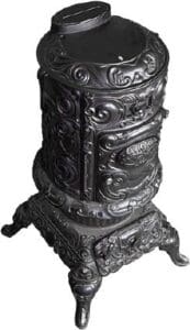 A black stove with ornate design on it.