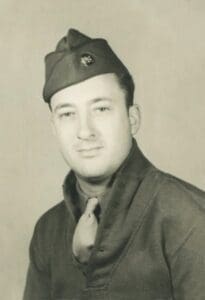 A man in uniform is posing for the camera.