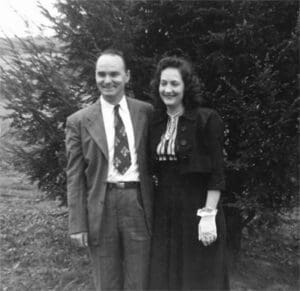 A man and woman standing next to each other.