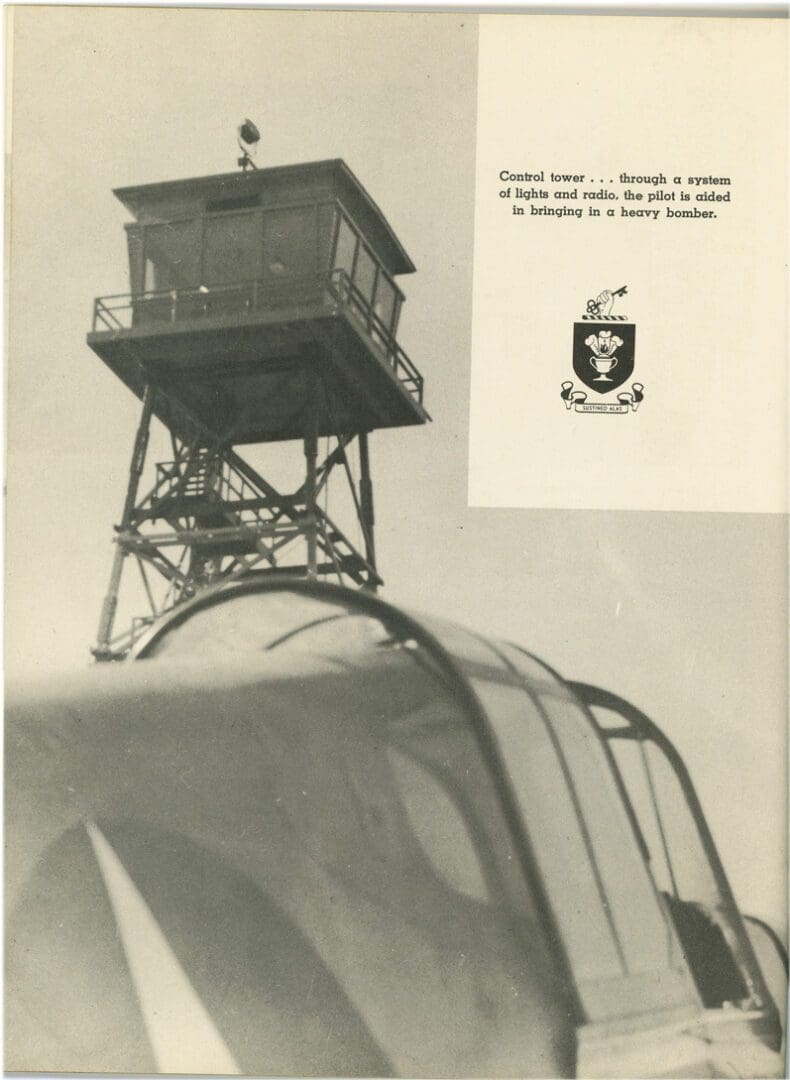 A black and white photo of a plane with a tower in the background.