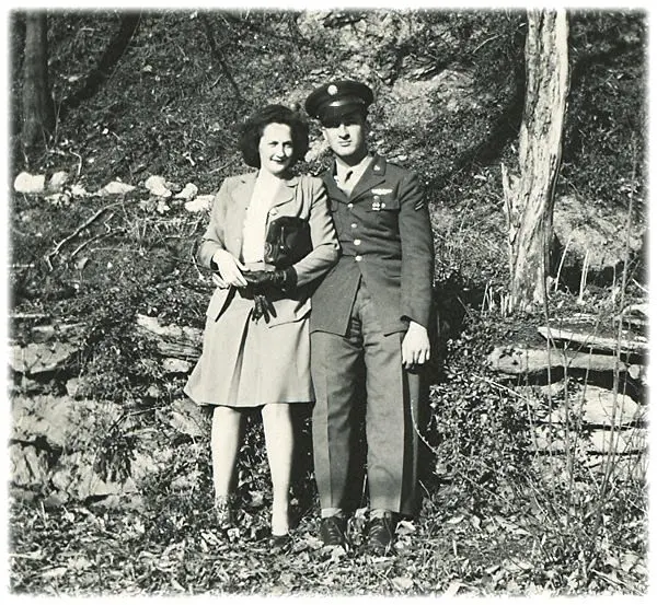 An old photo of a man and woman in uniform.