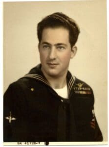 An old photo of a sailor in uniform.